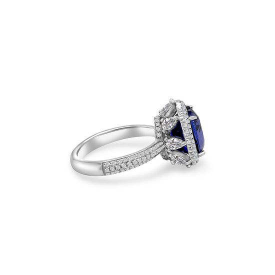 Oval Tanzanite and Halo Diamond Ring - 4.90ct Tanzanite Center Stone Exquisite Gemstone Jewelry - Oval Tanzanite with Diamond Halo Sophisticated Tanzanite and Diamond Ring - Blue-violet Oval Gemstone Halo Diamond Ring - 4.90ct Oval Tanzanite Centerpiece Elegant Tanzanite and Diamond Ring - Dazzling Gemstone Jewelry Glamorous Oval Tanzanite Ring - Sparkling Diamond Accents Special Occasion Accessory - 4.90ct Oval Tanzanite and Diamond Halo Unique Gemstone Jewelry - Brilliant Blue-violet Tanzanite Ring
