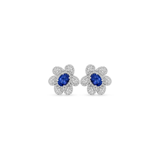 Main Image: "1.60ct Oval Tanzanite & Multi-Shape Floral Diamond Stud Earrings" Tanzanite Detail: "Vivid Oval Tanzanite Gemstone" Floral Diamond Arrangement: "Intricate Floral Diamond Design" Earring Profile: "Multi-Shape Floral Stud Earring Profile" Custom Open Liners: "Earrings with Different Open Liner Options" Timeless Elegance: "Diamond Stud Earrings with Tanzanite and Floral Design"