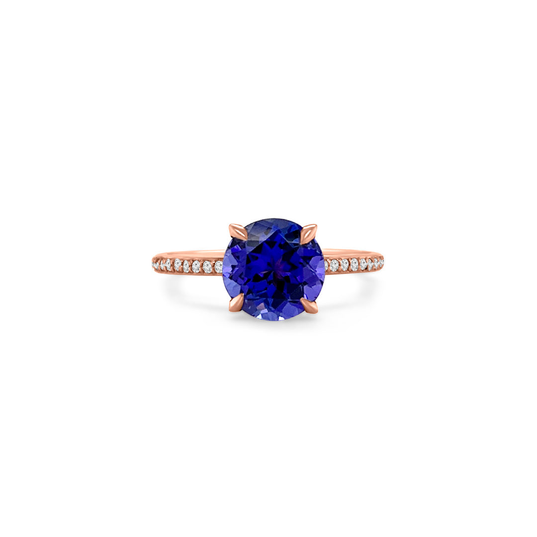 Main Image: "2.00ct Four Claw Round Tanzanite and Diamond Ring" Side View: "Round Tanzanite Gemstone Ring" Diamond Detail: "Diamond Accents on Tanzanite Ring" Elegance in Design: "Four Claw Setting with Tanzanite and Diamonds" Brilliance and Beauty: "Craftsmanship of Tanzanite and Diamond Ring"