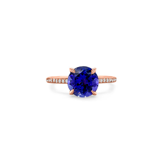 Main Image: "2.00ct Four Claw Round Tanzanite and Diamond Ring" Side View: "Round Tanzanite Gemstone Ring" Diamond Detail: "Diamond Accents on Tanzanite Ring" Elegance in Design: "Four Claw Setting with Tanzanite and Diamonds" Brilliance and Beauty: "Craftsmanship of Tanzanite and Diamond Ring"