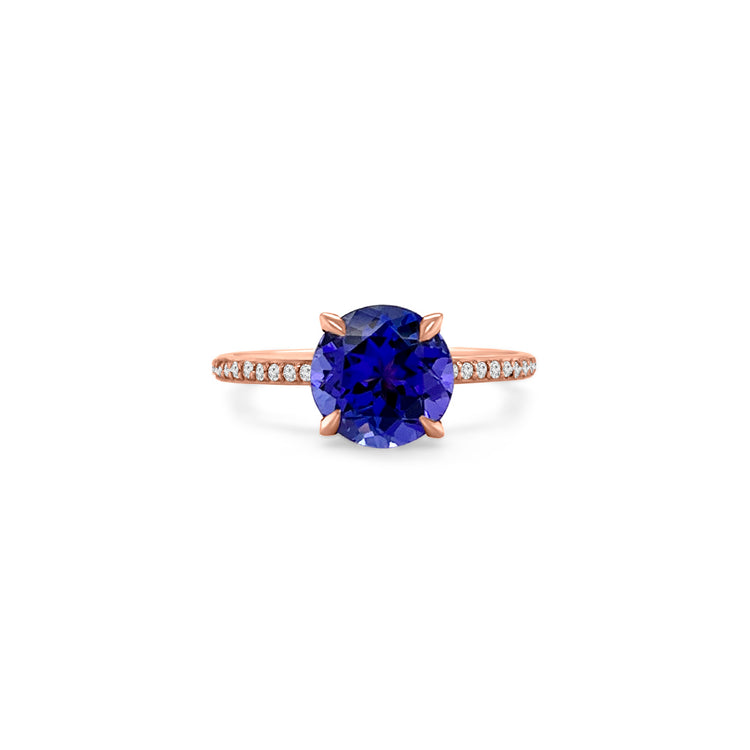 Main Image: "2.00ct Four Claw Round Tanzanite and Diamond Ring" Side View: "Round Tanzanite Gemstone Ring" Diamond Detail: "Diamond Accents on Tanzanite Ring" Elegance in Design: "Four Claw Setting with Tanzanite and Diamonds" Brilliance and Beauty: "Craftsmanship of Tanzanite and Diamond Ring"