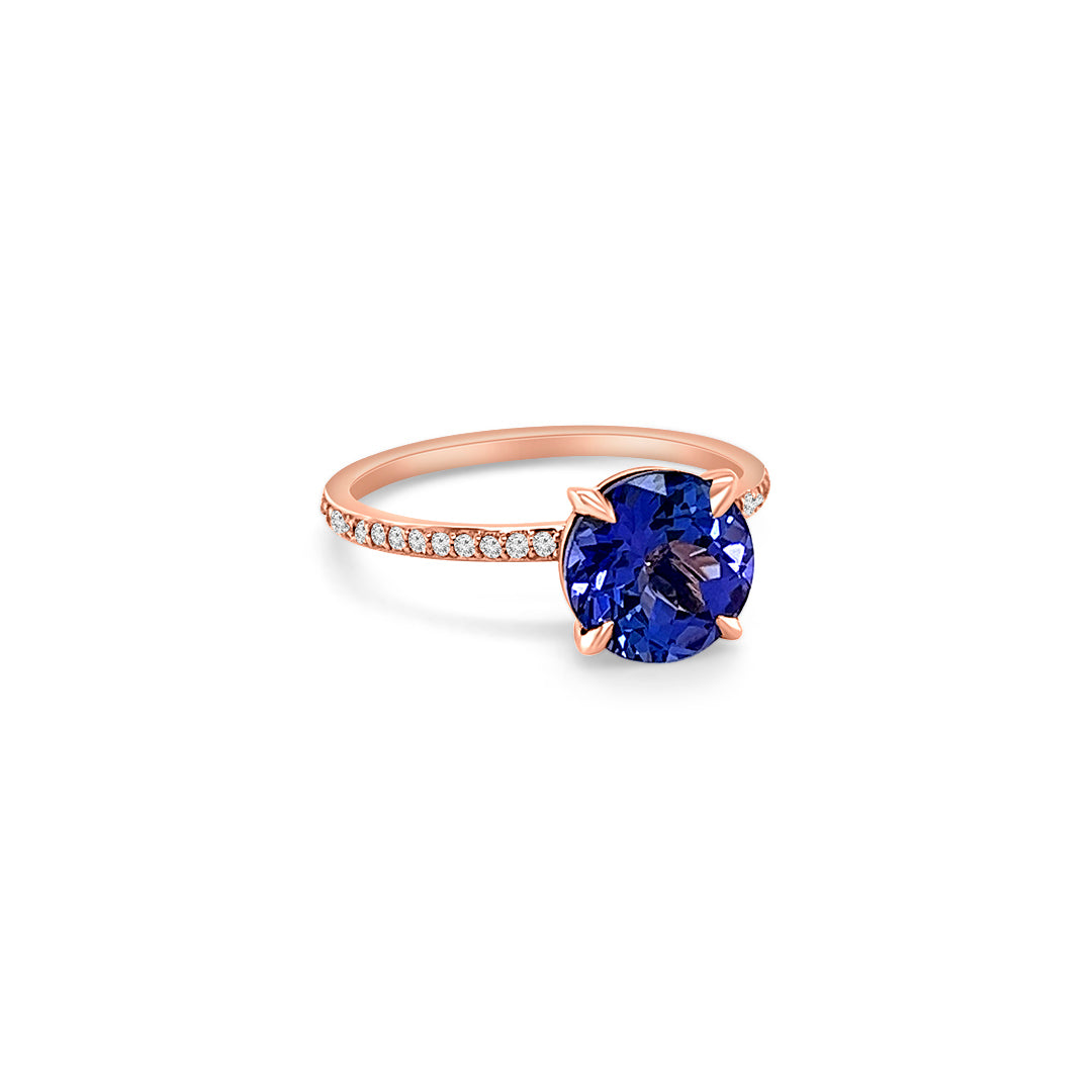 Main Image: "2.00ct Four Claw Round Tanzanite and Diamond Ring" Side View: "Round Tanzanite Gemstone Ring" Diamond Detail: "Diamond Accents on Tanzanite Ring" Elegance in Design: "Four Claw Setting with Tanzanite and Diamonds" Brilliance and Beauty: "Craftsmanship of Tanzanite and Diamond Ring"