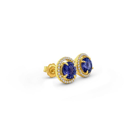 Exquisite round Tanzanite stud earrings, surrounded by a dazzling halo of brilliant diamonds. Elegant jewelry for special occasions, featuring vibrant Tanzanite gems and sparkling diamond accents. Stunning halo design, showcasing the beauty of round Tanzanite stones, complemented by the brilliance of diamonds. Perfect accessories to add a touch of glamour and sophistication to any ensemble