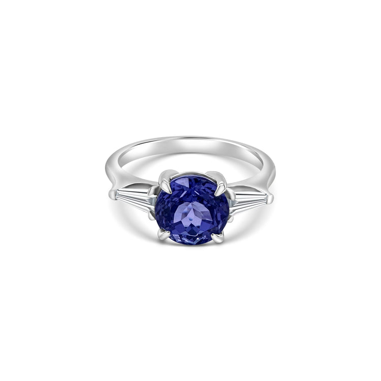 "Round Cut Tanzanite & Diamond Ring," "Exquisite Round Cut Tanzanite Ring," "Luxurious Diamond Jewelry with Round Cut Tanzanite," "Elegant Round Cut Gemstone Ring," "Fine Jewelry featuring Round Cut Tanzanite and Diamonds," "High-Quality Round Cut Tanzanite Ring," "Statement Round Cut Gemstone and Diamond Ring," "Sparkling Tanzanite and Diamond Jewelry with Round Cut," "Beautiful Round Cut Gemstone Ring," "Fashionable Tanzanite & Diamond Ring with Round Cut."