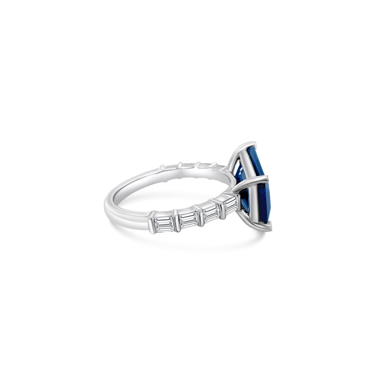 "Radiant sapphire ring, blue gemstone jewelry, sparkling diamond accents, elegant gemstone ring, luxury jewelry, statement ring, fine jewelry piece, special occasion accessory."