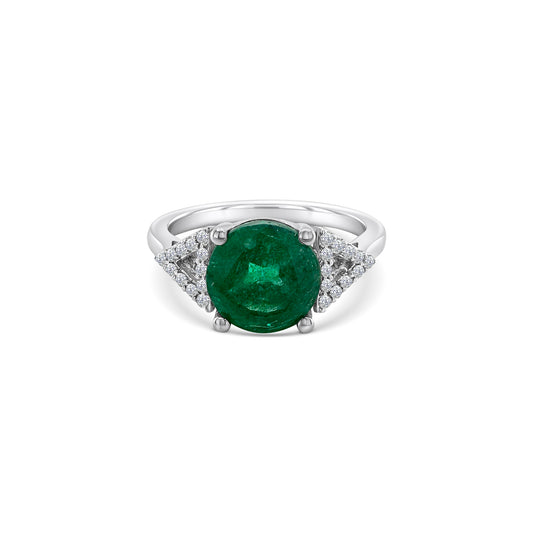 A round emerald & diamond halo ring, exquisite emerald and diamond ring, stunning emerald and diamond jewelry, elegant emerald and diamond engagement ring, beautiful emerald and diamond cocktail ring, luxurious emerald and diamond statement piece, captivating emerald and diamond accessory.