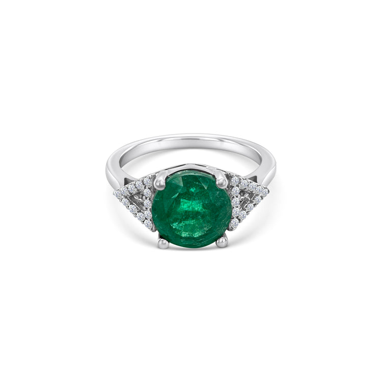 A round emerald & diamond halo ring, exquisite emerald and diamond ring, stunning emerald and diamond jewelry, elegant emerald and diamond engagement ring, beautiful emerald and diamond cocktail ring, luxurious emerald and diamond statement piece, captivating emerald and diamond accessory.