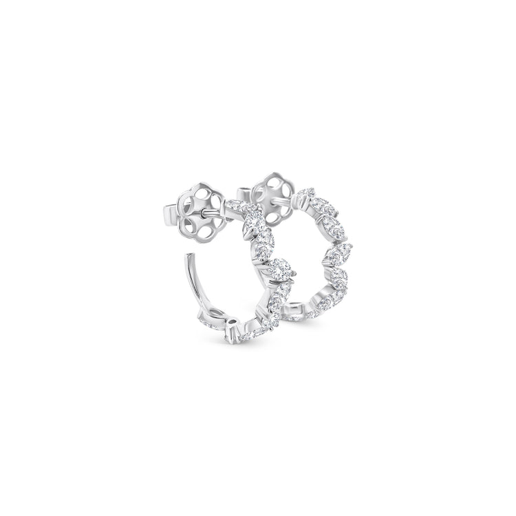 Oval cut diamond hoop earrings, elegant oval diamond hoops, sparkling oval diamond earrings, luxury diamond hoop earrings, oval diamond jewelry, fine diamond hoop earrings, oval cut diamond accessories, glamorous diamond hoop earrings, oval diamond ear hoops, sophisticated oval diamond earrings, timeless oval cut diamond hoops, stylish diamond hoop earrings, exquisite oval diamond earrings, high-end oval diamond hoops, fashionable oval cut diamond earrings.