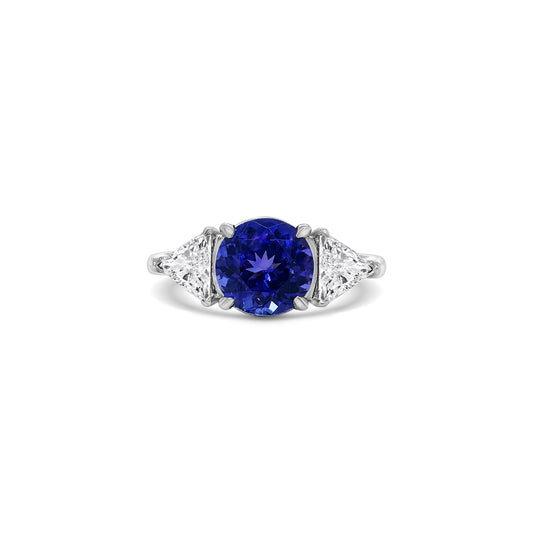 "Round Cut Tanzanite & Diamond Ring," "Exquisite Round Cut Tanzanite Ring," "Luxurious Diamond Jewelry with Round Cut Tanzanite," "Elegant Round Cut Gemstone Ring," "Fine Jewelry featuring Round Cut Tanzanite and Diamonds," "High-Quality Round Cut Tanzanite Ring," "Statement Round Cut Gemstone and Diamond Ring," "Sparkling Tanzanite and Diamond Jewelry with Round Cut," "Beautiful Round Cut Gemstone Ring," "Fashionable Tanzanite & Diamond Ring with Round Cut."