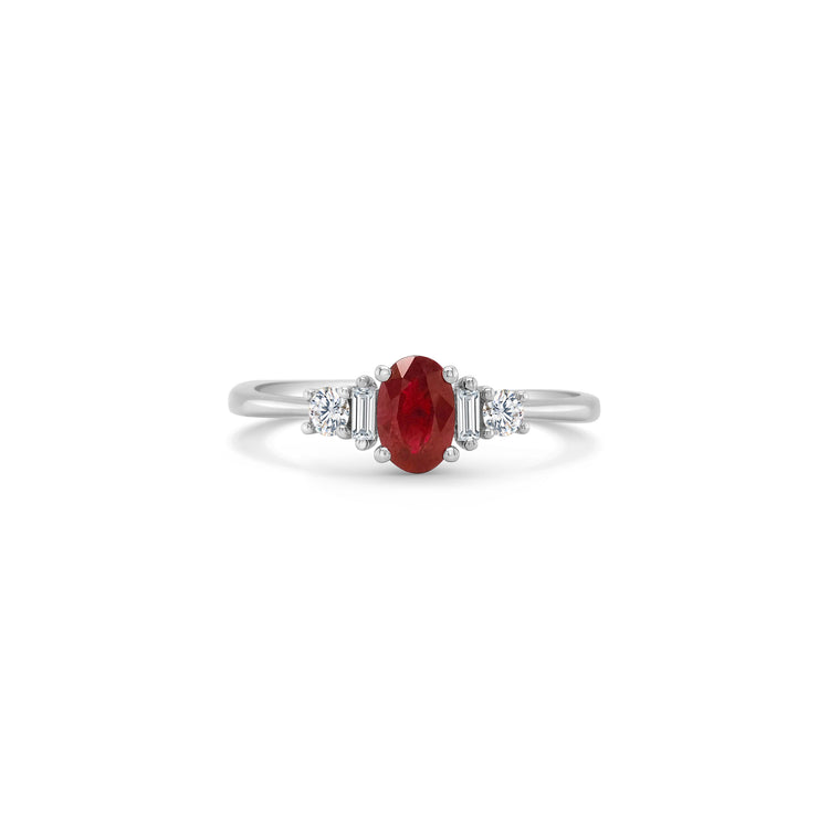 An elegant, oval ruby ring, adorned with sparkling diamonds, perfect for special occasions, adding sophistication and glamour to any ensemble.