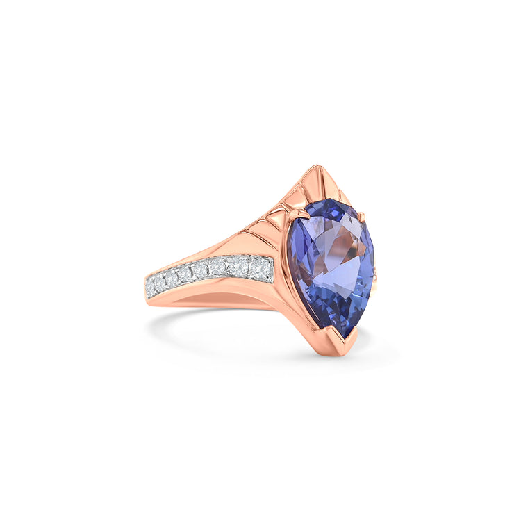 "Pear Shaped Tanzanite Ring, Tanzanite and Diamond Ring, Pear Cut Tanzanite Jewelry, Blue Gemstone Ring, Pear Shaped Engagement Ring, Tanzanite Ring with Diamonds, Pear Shaped Blue Stone Ring, Elegant Tanzanite Diamond Ring, Pear Shaped Tanzanite and Diamond Ring."