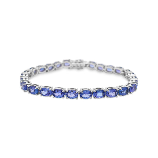 "Oval Cut Tanzanite Tennis Bracelet," "Tanzanite Tennis Bracelet," "Fine Jewelry," "Luxury Bracelet," "Fashion Bracelet," "Gemstone Jewelry," "Sparkling Tanzanite Bracelet," "Statement Bracelet," "Elegant Jewelry," "Special Occasion Bracelet," "Tanzanite Jewelry," "Timeless Jewelry," "Handcrafted Bracelet," "Unique Gemstone Bracelet," "Classic Tennis Bracelet."