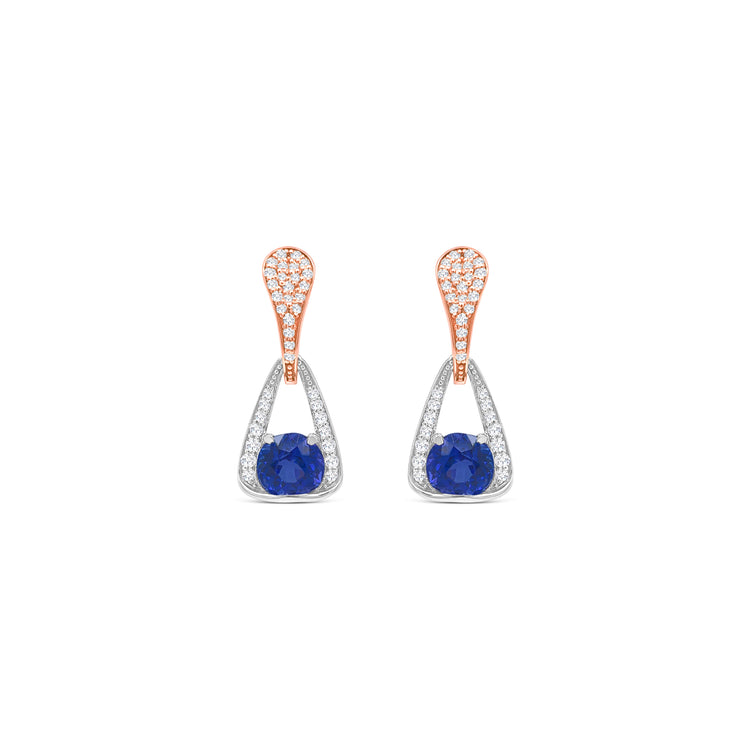Elegant round tanzanite and diamond drop earrings in white gold, Close-up of sparkling tanzanite and diamond drop earrings, Luxury round tanzanite earrings with diamond accents, Women's tanzanite and diamond drop earrings, Fine jewelry round tanzanite and diamond drops, Handcrafted round tanzanite and diamond drop earrings