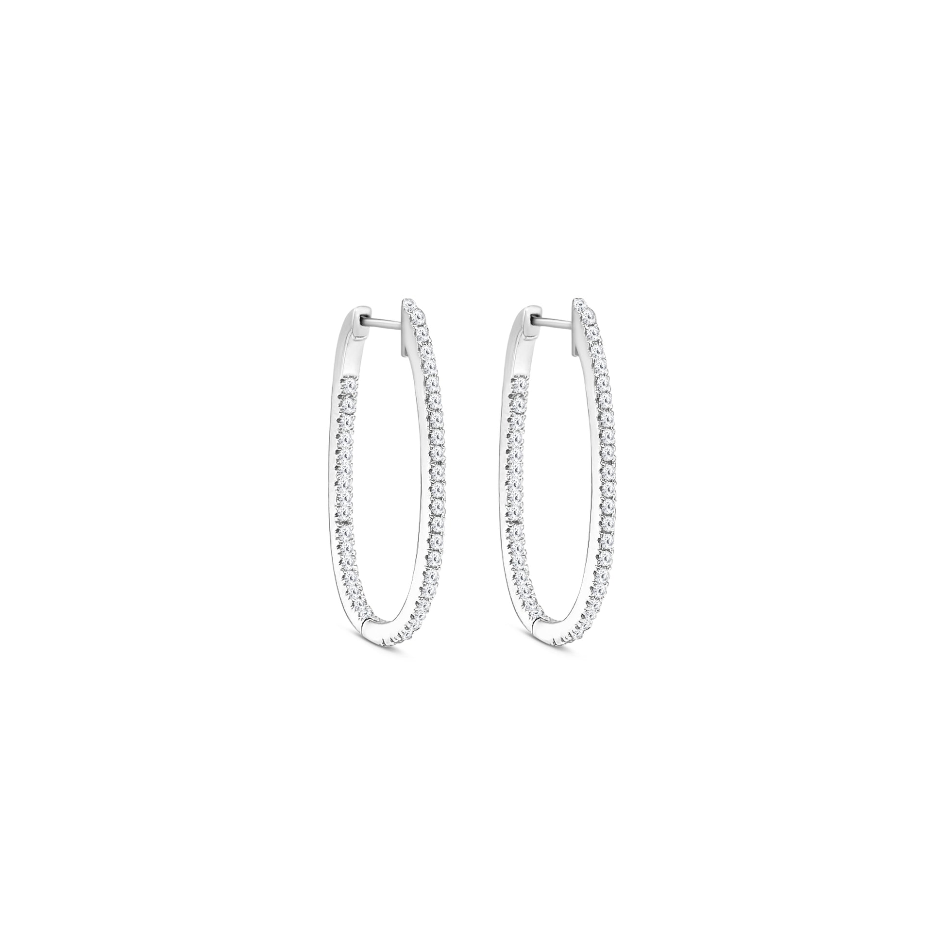 Elegant round brilliant diamond hoop earrings in white gold, Close-up of sparkling round brilliant diamond hoops, Luxury hoop earrings with round brilliant cut diamonds, Women's round brilliant diamond hoop earrings, Fine jewelry diamond hoops with round brilliant stones, Handcrafted round brilliant diamond hoop earrings