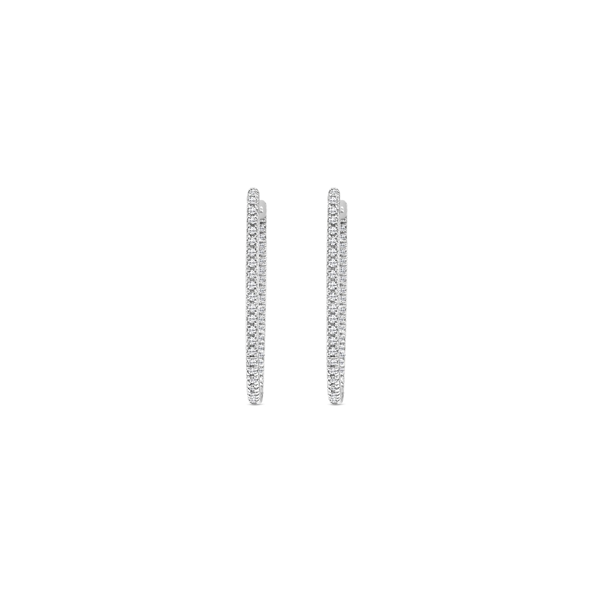 Elegant round brilliant diamond hoop earrings in white gold, Close-up of sparkling round brilliant diamond hoops, Luxury hoop earrings with round brilliant cut diamonds, Women's round brilliant diamond hoop earrings, Fine jewelry diamond hoops with round brilliant stones, Handcrafted round brilliant diamond hoop earrings