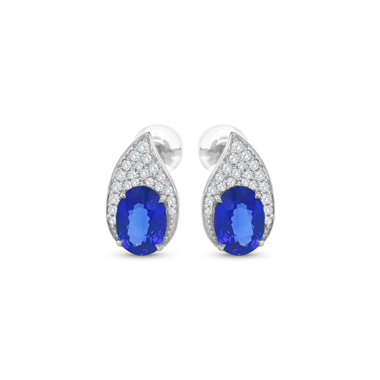 Tanzanite and diamond teardrop earrings, oval tanzanite diamond earrings, blue tanzanite and diamond stud earrings, white gold tanzanite teardrop earrings, luxury tanzanite and diamond earrings for women, elegant blue gemstone diamond earrings, natural tanzanite and diamond cluster earrings, fine jewelry tanzanite diamond earrings, sapphire blue tanzanite and diamond earrings, teardrop design tanzanite and diamond earrings.