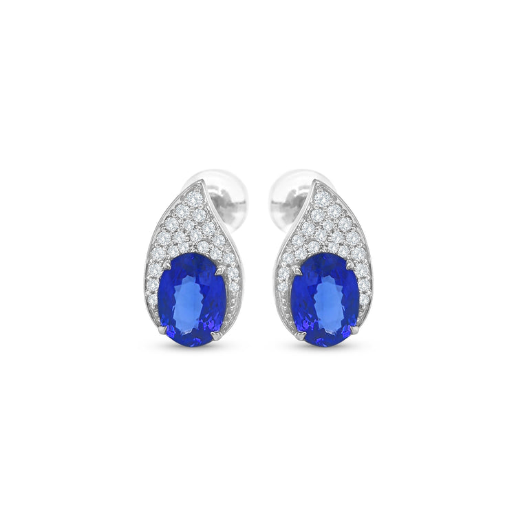 Tanzanite and diamond teardrop earrings, oval tanzanite diamond earrings, blue tanzanite and diamond stud earrings, white gold tanzanite teardrop earrings, luxury tanzanite and diamond earrings for women, elegant blue gemstone diamond earrings, natural tanzanite and diamond cluster earrings, fine jewelry tanzanite diamond earrings, sapphire blue tanzanite and diamond earrings, teardrop design tanzanite and diamond earrings.