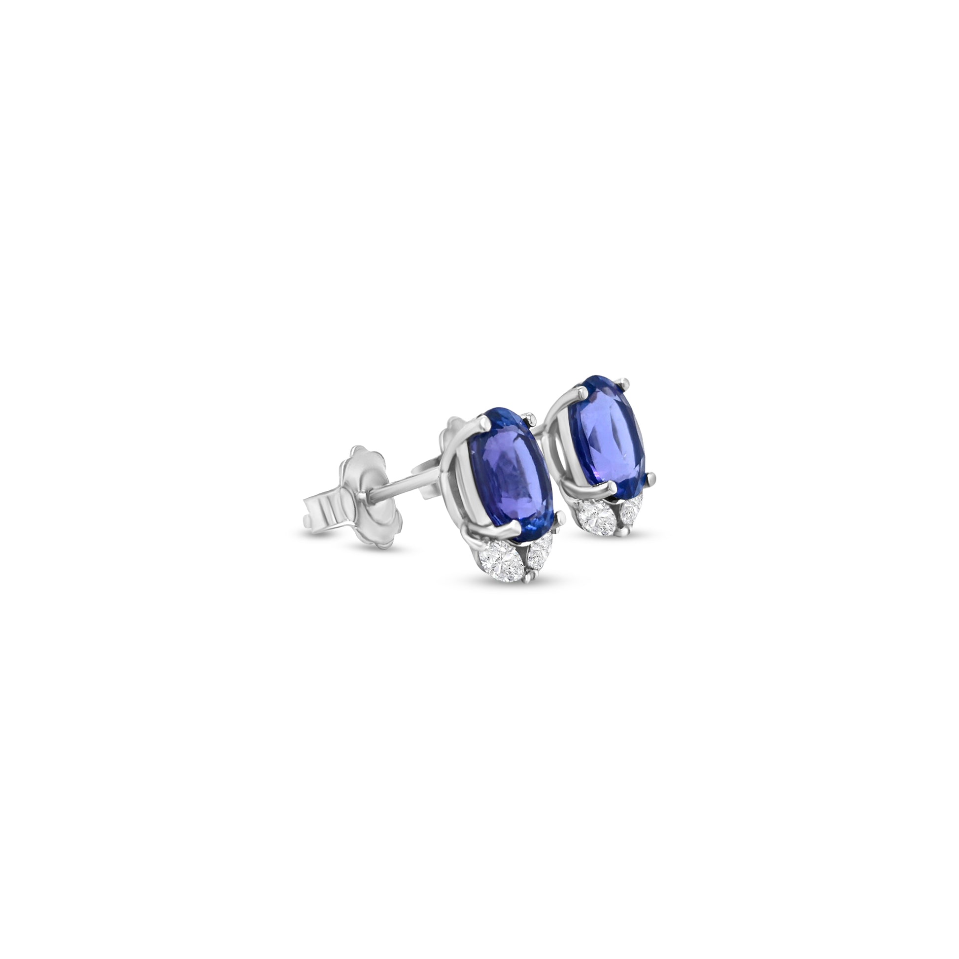 Elegant oval tanzanite and diamond stud earrings that exude sophistication and charm. Each earring features a vibrant oval-shaped tanzanite gemstone, beautifully complemented by sparkling accent diamonds, creating a stunning combination of color and brilliance. Perfect for adding a touch of luxury to any outfit, these earrings offer a timeless design that transitions effortlessly from day to night. Crafted with precision and care, the oval tanzanite and diamond studs are a captivating choice for those who a
