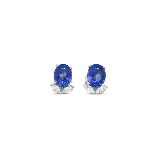 Elegant oval tanzanite and diamond stud earrings that exude sophistication and charm. Each earring features a vibrant oval-shaped tanzanite gemstone, beautifully complemented by sparkling accent diamonds, creating a stunning combination of color and brilliance. Perfect for adding a touch of luxury to any outfit, these earrings offer a timeless design that transitions effortlessly from day to night. Crafted with precision and care, the oval tanzanite and diamond studs are a captivating choice for those who a