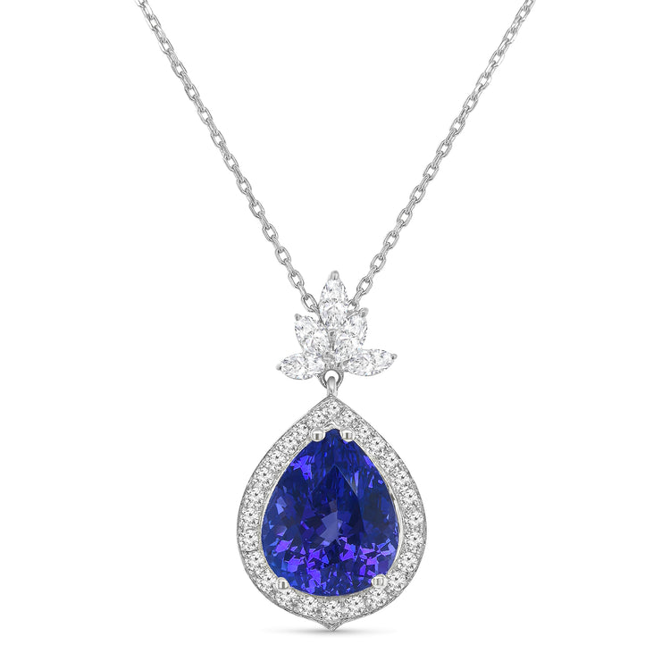 Pear shape tanzanite pendant, tanzanite and diamond halo pendant, pear cut gemstone jewelry, elegant tanzanite necklace, fine jewelry pendant, luxury gemstone necklace, pear cut tanzanite diamond pendant, halo tanzanite pendant necklace, designer gemstone pendant, tanzanite birthstone jewelry.