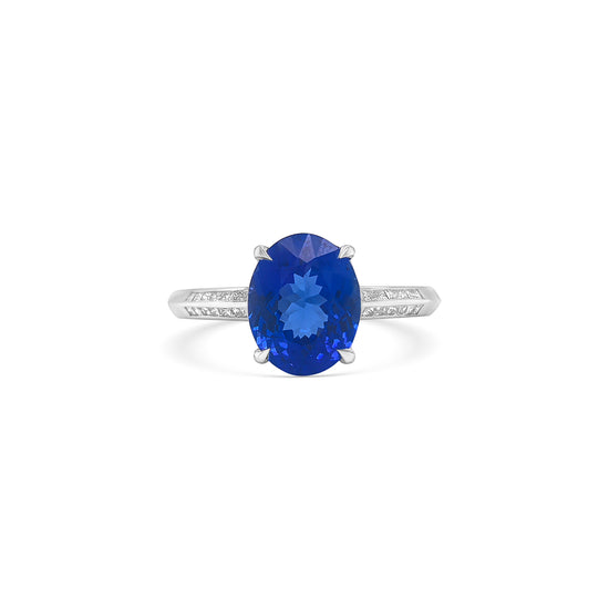 "Oval Cut Tanzanite & Diamond Ring," "Luxury Oval Tanzanite and Diamond Ring," "Elegant Oval Cut Tanzanite Diamond Engagement Ring," "Oval Tanzanite with Diamond Accents Ring," "Exquisite Oval Cut Tanzanite & Diamond Cocktail Ring," "Fine Jewelry Oval Cut Tanzanite and Diamond Ring," "Unique Oval Tanzanite and Diamond Ring Design," "Beautiful Oval Cut Tanzanite & Diamond Ring," "Timeless Oval Tanzanite and Diamond Ring," "Sparkling Oval Cut Tanzanite with Diamond Ring."