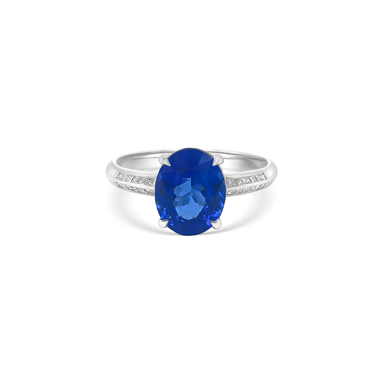 "Oval Cut Tanzanite & Diamond Ring," "Luxury Oval Tanzanite and Diamond Ring," "Elegant Oval Cut Tanzanite Diamond Engagement Ring," "Oval Tanzanite with Diamond Accents Ring," "Exquisite Oval Cut Tanzanite & Diamond Cocktail Ring," "Fine Jewelry Oval Cut Tanzanite and Diamond Ring," "Unique Oval Tanzanite and Diamond Ring Design," "Beautiful Oval Cut Tanzanite & Diamond Ring," "Timeless Oval Tanzanite and Diamond Ring," "Sparkling Oval Cut Tanzanite with Diamond Ring."