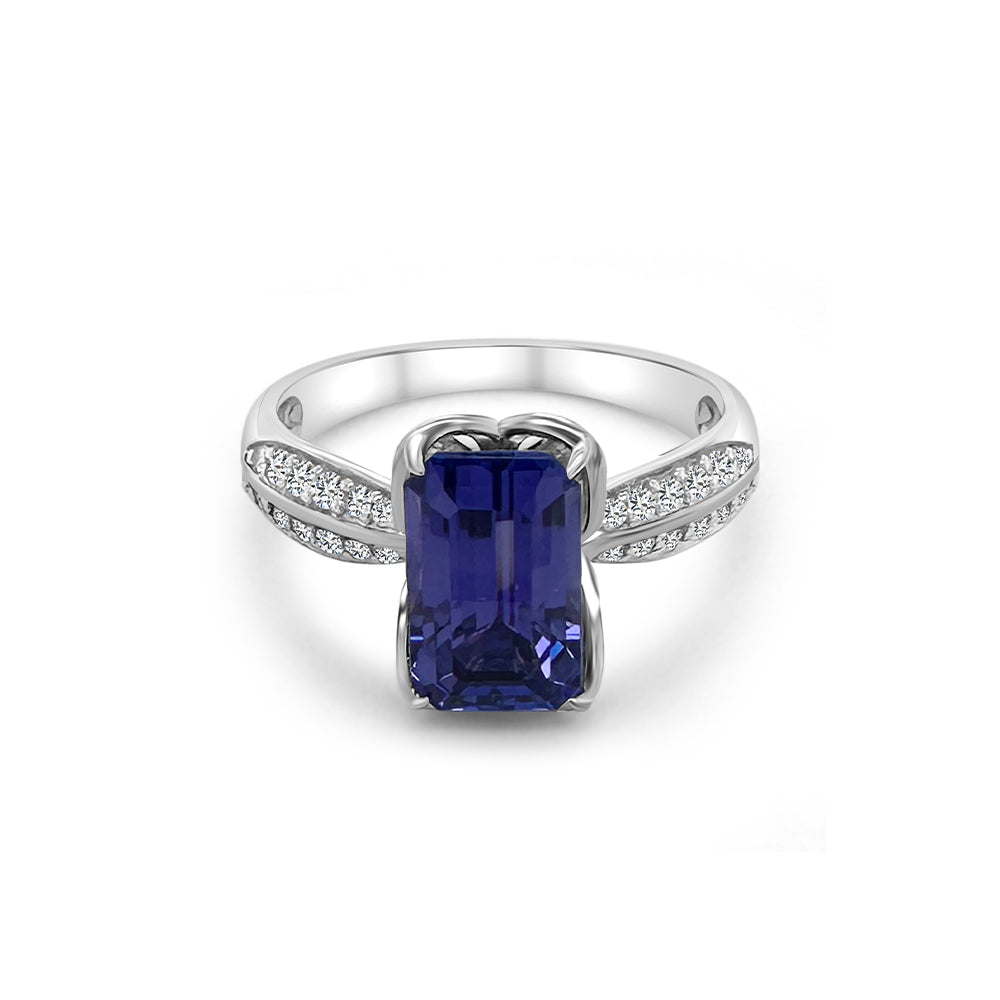 "Emerald Cut Tanzanite & Diamond Ring," "Exquisite Emerald Cut Tanzanite Engagement Ring," "Luxurious Tanzanite and Diamond Ring with Emerald Cut," "Elegant Emerald Cut Tanzanite Diamond Ring," "Fine Jewelry Emerald Cut Tanzanite with Diamonds," "High-Quality Tanzanite Emerald Cut Diamond Ring," "Statement Emerald Cut Tanzanite and Diamond Band," "Sparkling Emerald Cut Tanzanite and Diamond Ring," "Beautiful Emerald Cut Tanzanite Wedding Ring," "Fashionable Tanzanite Diamond Ring with Emerald Cut."