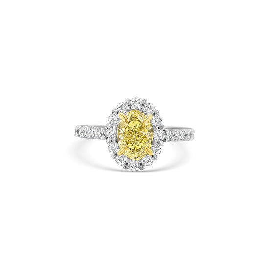 Discover timeless elegance with this Fancy Yellow Oval and Floral Diamond Halo Ring. A stunning blend of luxury and craftsmanship, perfect for any special occasion