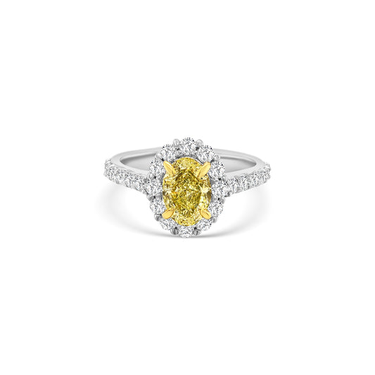Discover timeless elegance with this Fancy Yellow Oval and Floral Diamond Halo Ring. A stunning blend of luxury and craftsmanship, perfect for any special occasion