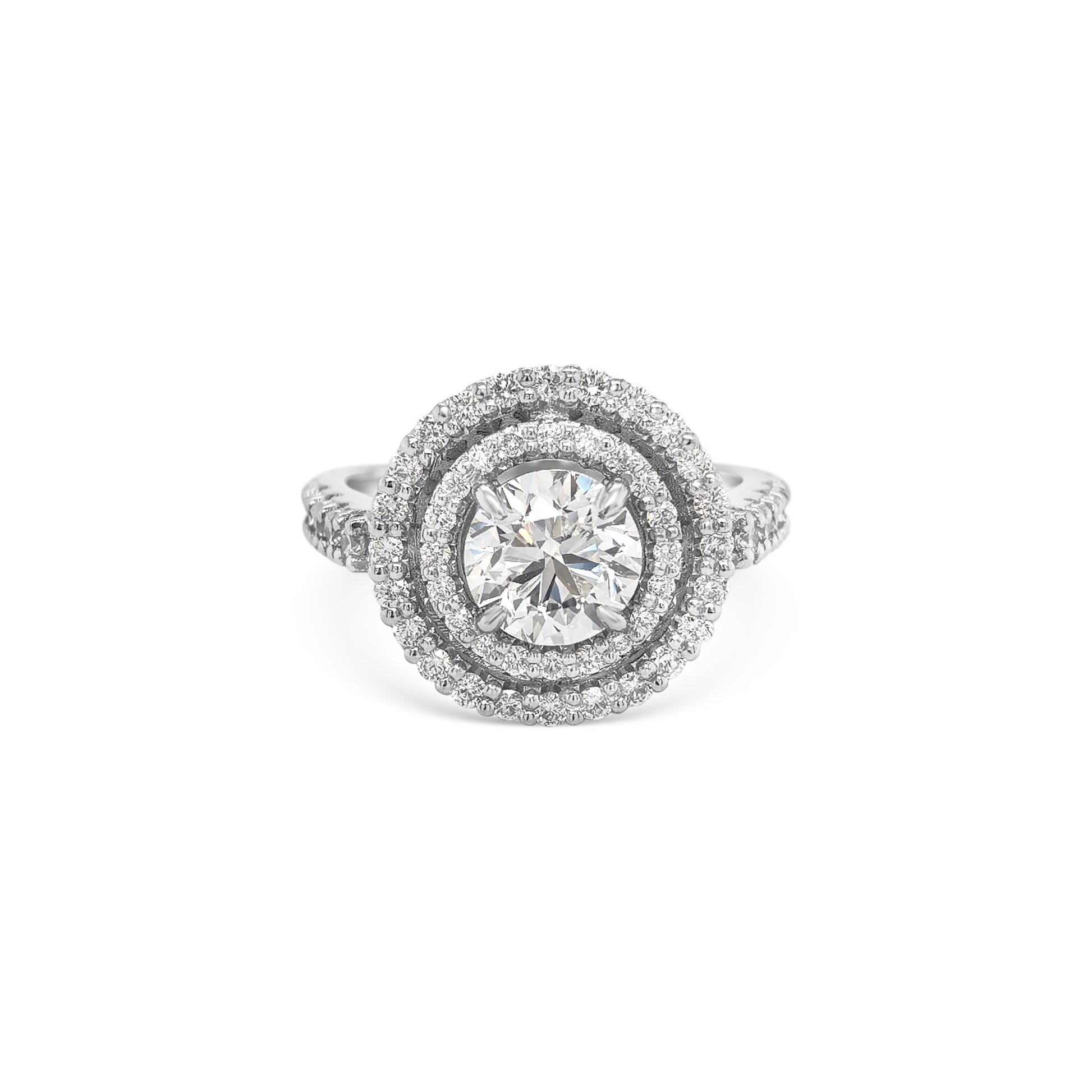 Round brilliant cut diamond ring with double halo setting, Elegant double halo ring featuring round brilliant diamond center, Luxury round diamond engagement ring with double halo design, White gold ring with round brilliant diamond and double halo, Sparkling round cut diamond ring with double halo of accent stones, Round brilliant engagement ring with intricate double halo, Classic round brilliant cut diamond ring in double halo setting