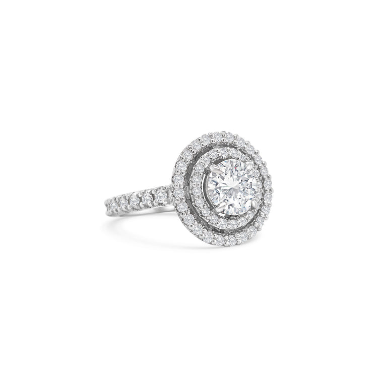 Round brilliant cut diamond ring with double halo setting, Elegant double halo ring featuring round brilliant diamond center, Luxury round diamond engagement ring with double halo design, White gold ring with round brilliant diamond and double halo, Sparkling round cut diamond ring with double halo of accent stones, Round brilliant engagement ring with intricate double halo, Classic round brilliant cut diamond ring in double halo setting