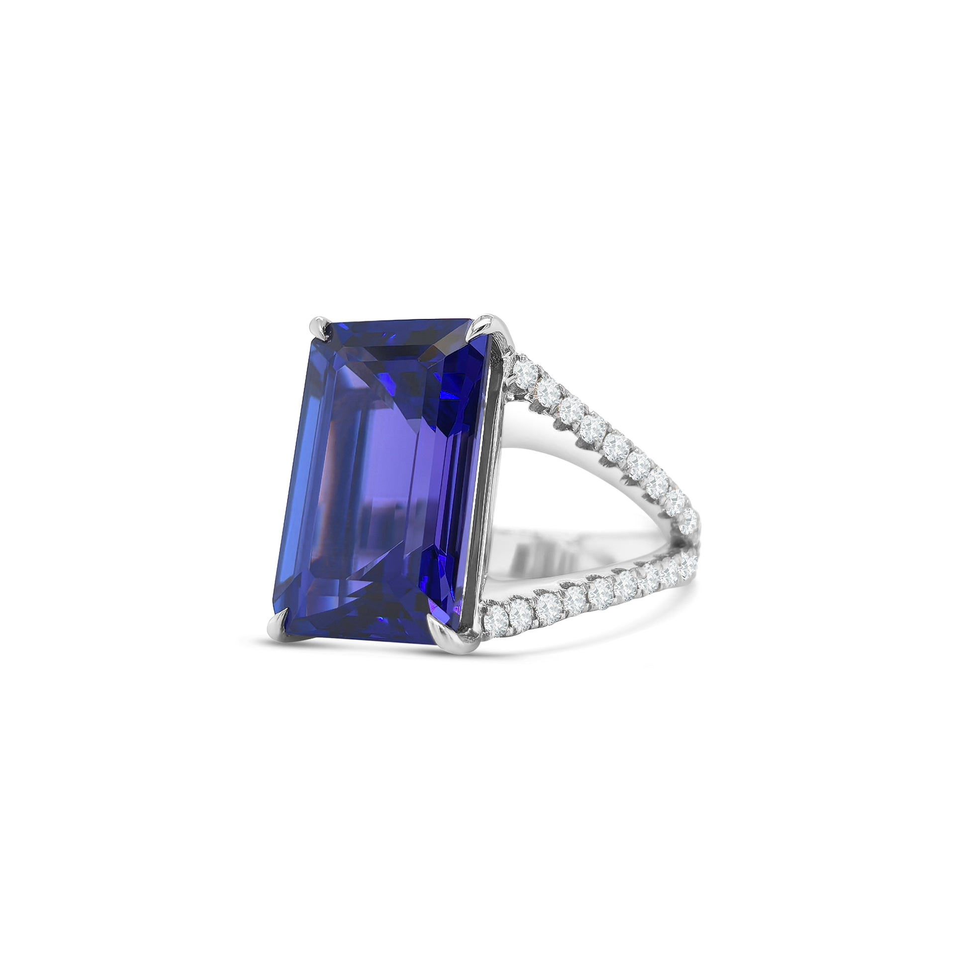 Emerald cut tanzanite ring with split shank diamond band, Elegant emerald cut tanzanite and diamond ring with split shank design, Split shank ring featuring vibrant emerald cut tanzanite center stone, White gold ring with emerald cut tanzanite and diamond accents, Luxurious emerald cut tanzanite ring framed by split shank diamonds, Statement ring with emerald cut tanzanite and diamond split shank, Modern split shank diamond ring with vivid emerald cut tanzanite