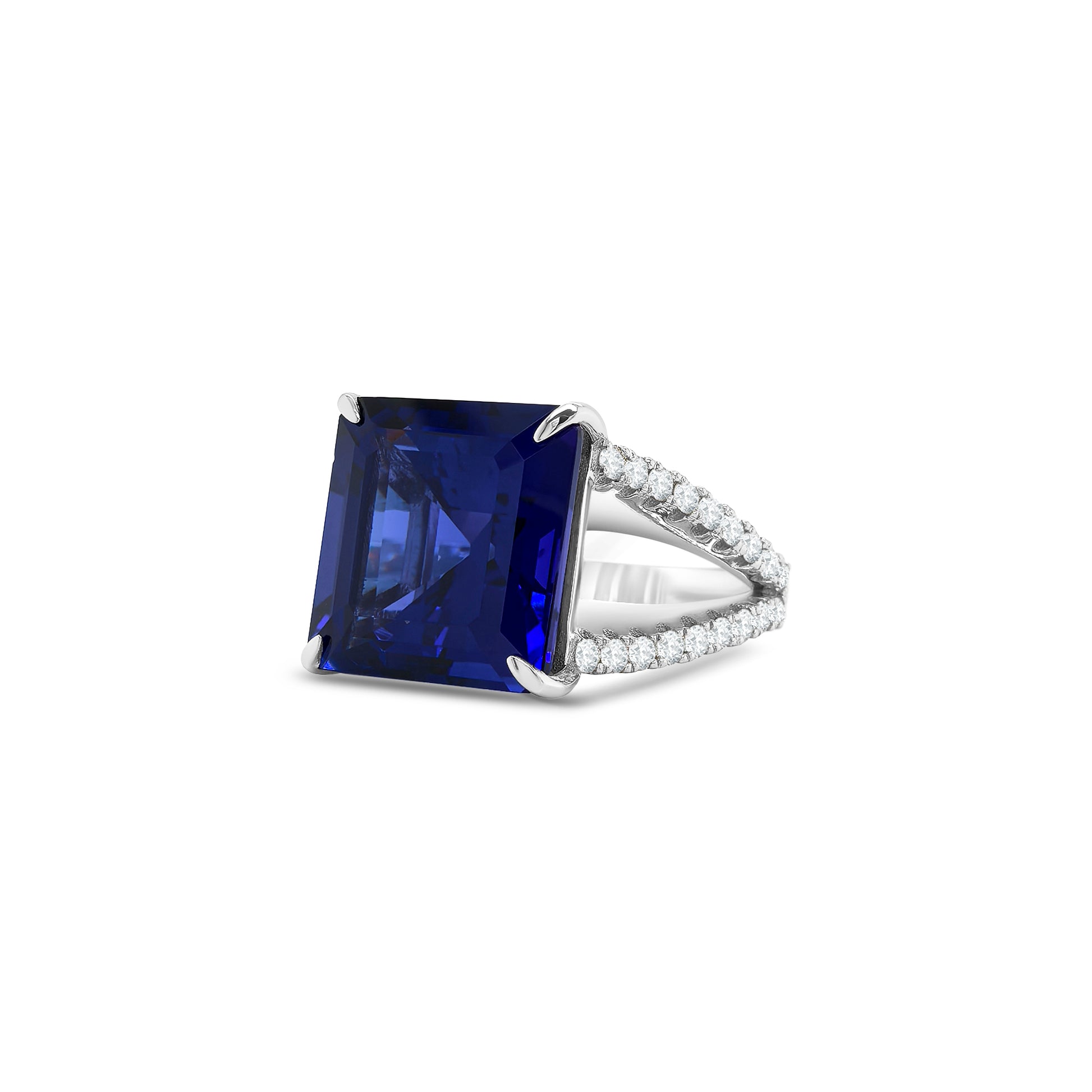 Square emerald-cut tanzanite ring with split shank diamond band, Elegant split shank ring featuring square emerald tanzanite center stone, Luxury tanzanite and diamond ring with emerald-cut design, White gold ring with square emerald tanzanite and split shank detail, Bold emerald-cut tanzanite ring with sparkling diamond split band, Square tanzanite gemstone ring with modern split shank setting, Sophisticated split shank diamond ring with emerald-cut tanzanite centerpiece
