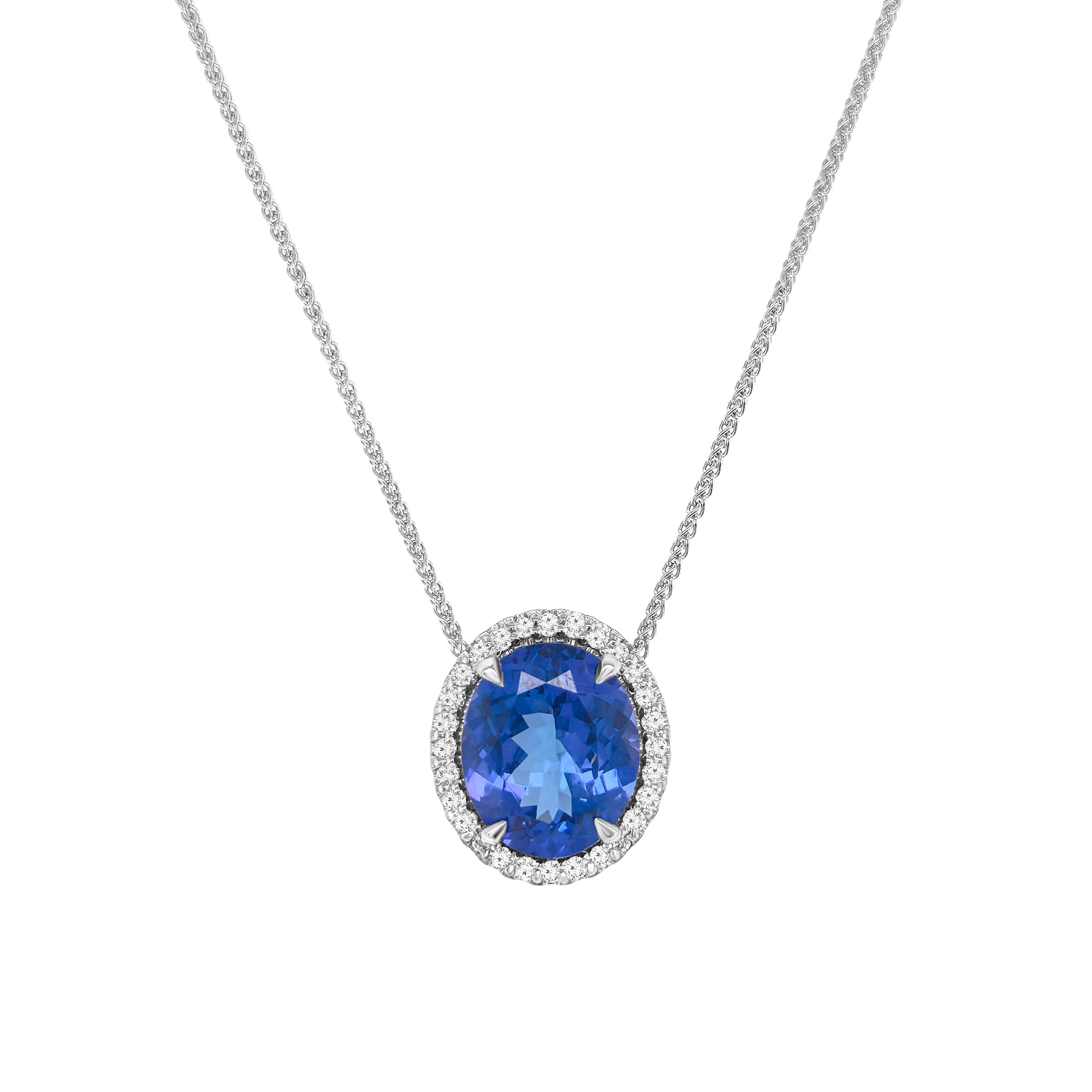 Oval tanzanite and halo diamond necklace, Elegant necklace with oval-cut tanzanite and diamond halo, Luxury halo diamond pendant featuring oval tanzanite center, White gold necklace with oval tanzanite and halo diamonds, Sparkling tanzanite necklace with halo diamond accents, Statement necklace with oval tanzanite surrounded by diamonds, Delicate oval tanzanite pendant with shimmering diamond halo