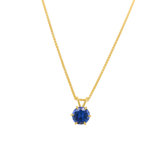 Round Cut Tanzanite Pendant featuring a vibrant violet-blue gemstone set in an elegant metal frame, designed for a timeless and sophisticated look.