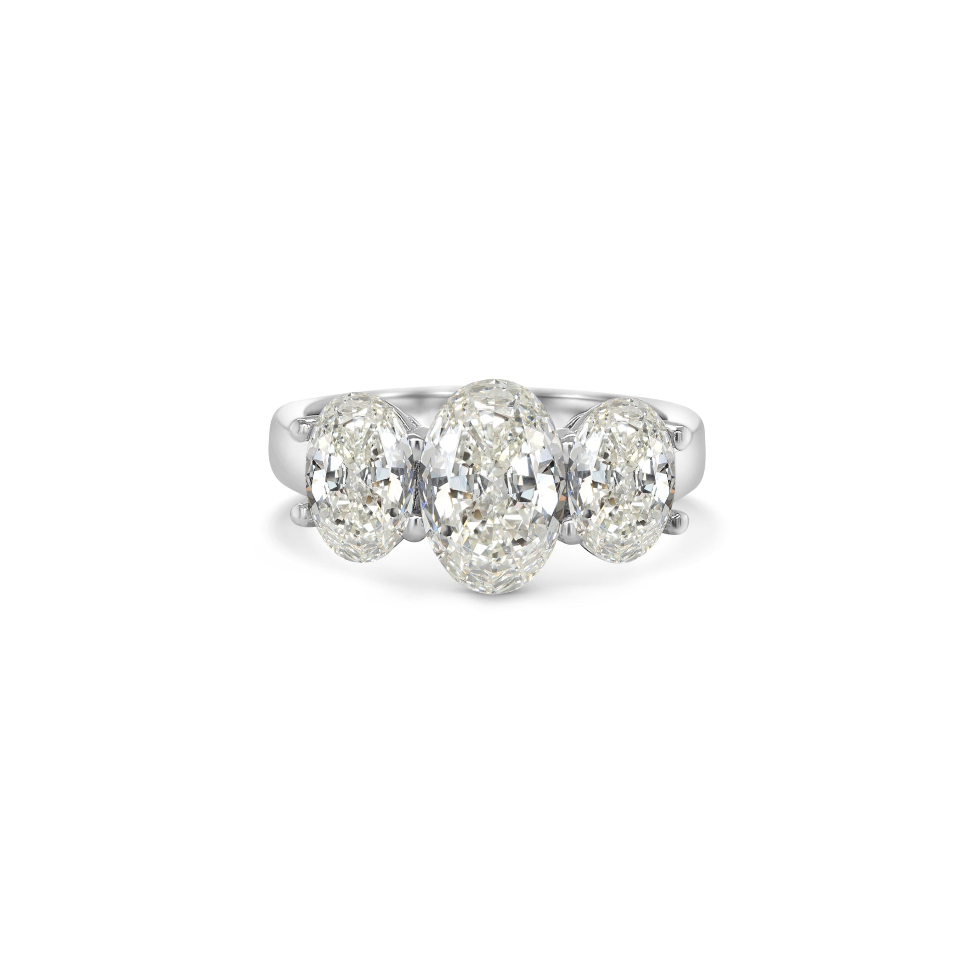 Elegant oval trilogy diamond ring featuring three oval-cut diamonds on a polished band