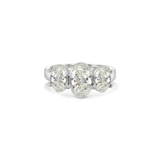 Elegant oval trilogy diamond ring featuring three oval-cut diamonds on a polished band