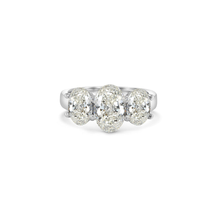 Elegant oval trilogy diamond ring featuring three oval-cut diamonds on a polished band