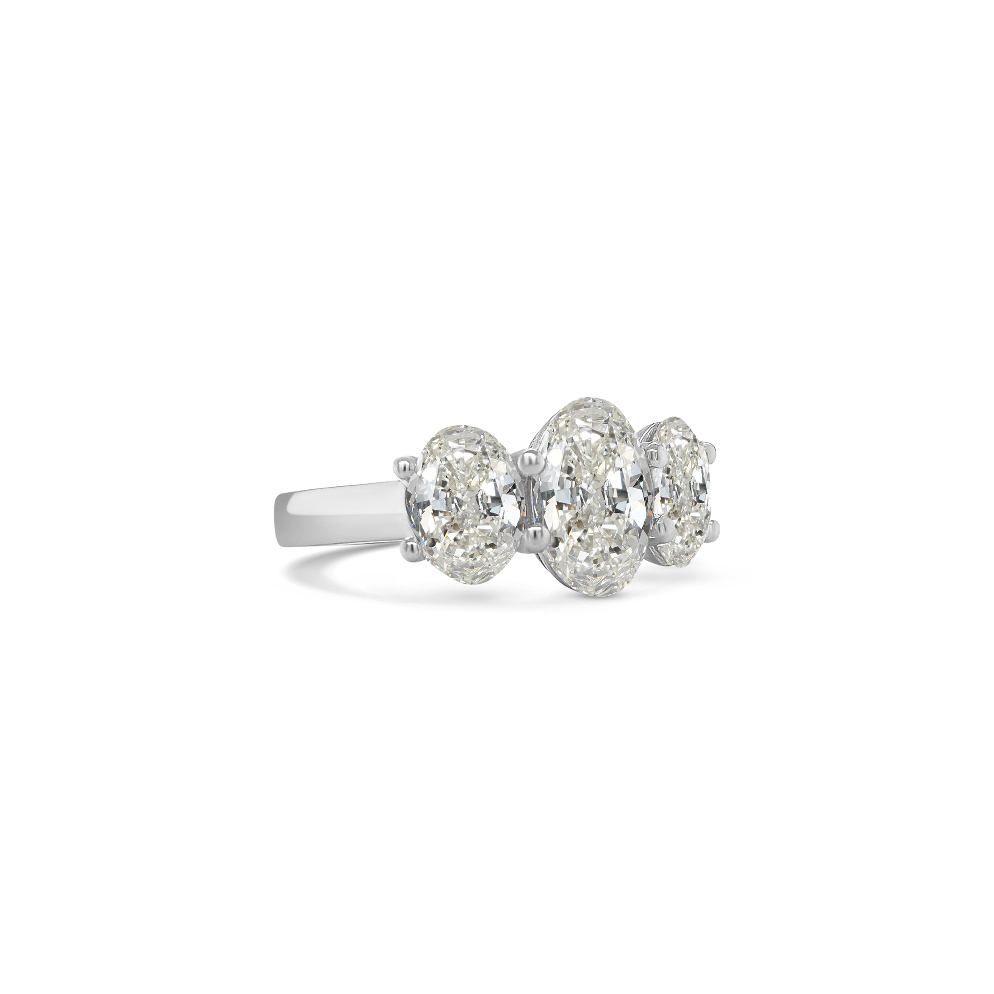 Elegant oval trilogy diamond ring featuring three oval-cut diamonds on a polished band