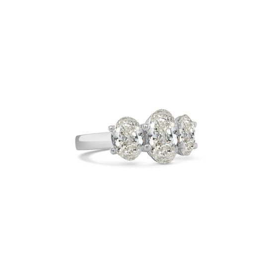 Elegant oval trilogy diamond ring featuring three oval-cut diamonds on a polished band