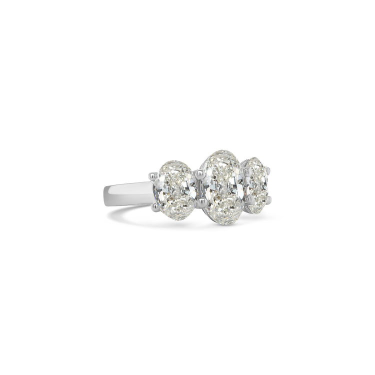 Elegant oval trilogy diamond ring featuring three oval-cut diamonds on a polished band