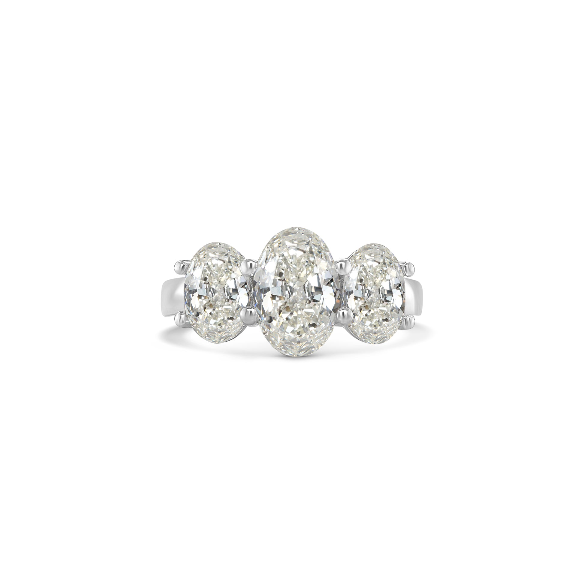 Elegant oval trilogy diamond ring featuring three oval-cut diamonds on a polished band