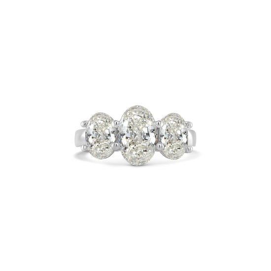 Elegant oval trilogy diamond ring featuring three oval-cut diamonds on a polished band