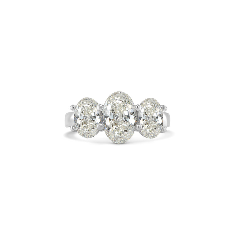 Elegant oval trilogy diamond ring featuring three oval-cut diamonds on a polished band