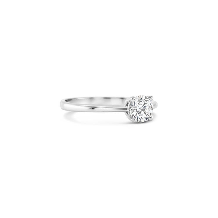 Solitaire round brilliant diamond ring, Classic solitaire engagement ring with round brilliant cut, Elegant round brilliant cut diamond solitaire in white gold, Timeless round diamond solitaire ring setting, Minimalist solitaire ring featuring round brilliant diamond, Round brilliant solitaire engagement ring in prong setting, Dainty round diamond solitaire ring for engagement or special occasions