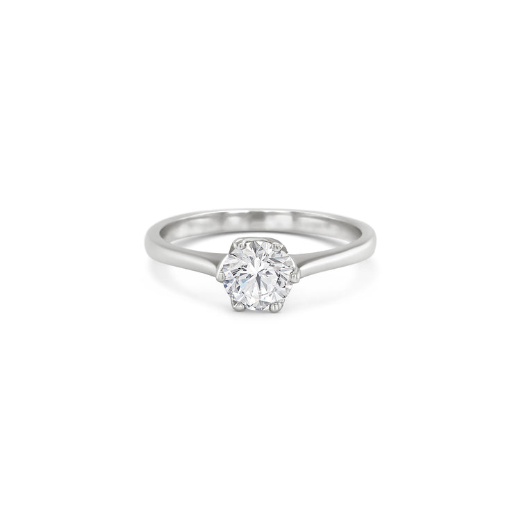 Solitaire round brilliant diamond ring, Classic solitaire engagement ring with round brilliant cut, Elegant round brilliant cut diamond solitaire in white gold, Timeless round diamond solitaire ring setting, Minimalist solitaire ring featuring round brilliant diamond, Round brilliant solitaire engagement ring in prong setting, Dainty round diamond solitaire ring for engagement or special occasions