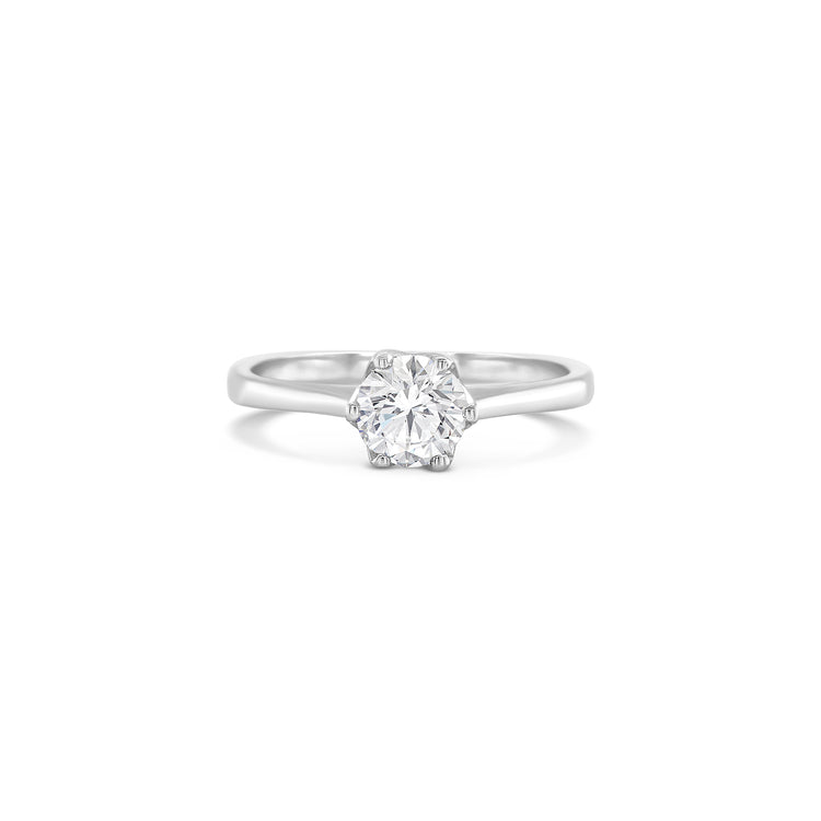 Solitaire round brilliant diamond ring, Classic solitaire engagement ring with round brilliant cut, Elegant round brilliant cut diamond solitaire in white gold, Timeless round diamond solitaire ring setting, Minimalist solitaire ring featuring round brilliant diamond, Round brilliant solitaire engagement ring in prong setting, Dainty round diamond solitaire ring for engagement or special occasions