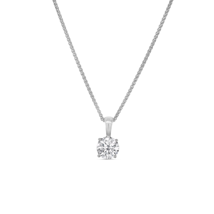 round brilliant diamond pendant, solitaire diamond necklace, classic diamond jewelry, round cut diamond pendant, elegant diamond pendant, fine jewelry necklace, timeless diamond pendant, white gold solitaire pendant, luxury diamond necklace, women’s diamond jewelry
