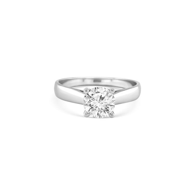 round brilliant solitaire diamond ring, solitaire engagement ring, classic diamond solitaire, round cut diamond ring, elegant diamond ring, timeless solitaire jewelry, women’s engagement ring, white gold solitaire ring, fine diamond jewelry, luxury solitaire diamond