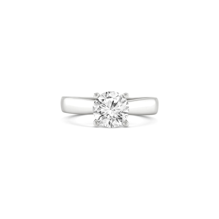 round brilliant solitaire diamond ring, solitaire engagement ring, classic diamond solitaire, round cut diamond ring, elegant diamond ring, timeless solitaire jewelry, women’s engagement ring, white gold solitaire ring, fine diamond jewelry, luxury solitaire diamond